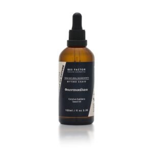 Bruine druppelflacon Bee Factor hazelnootolie met zwart etiket, 100 ml.